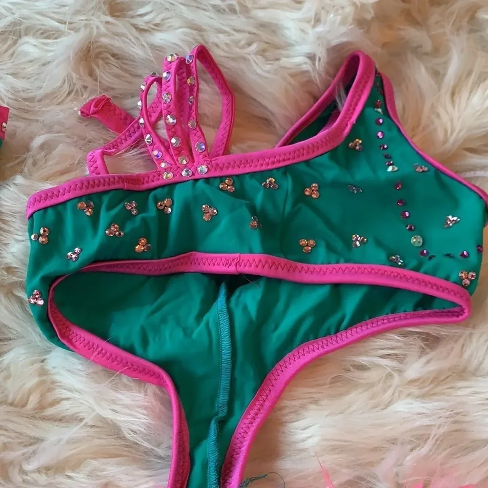 Custom dance costume with Swarovski Crystals. Teal and pink with arm sleeves